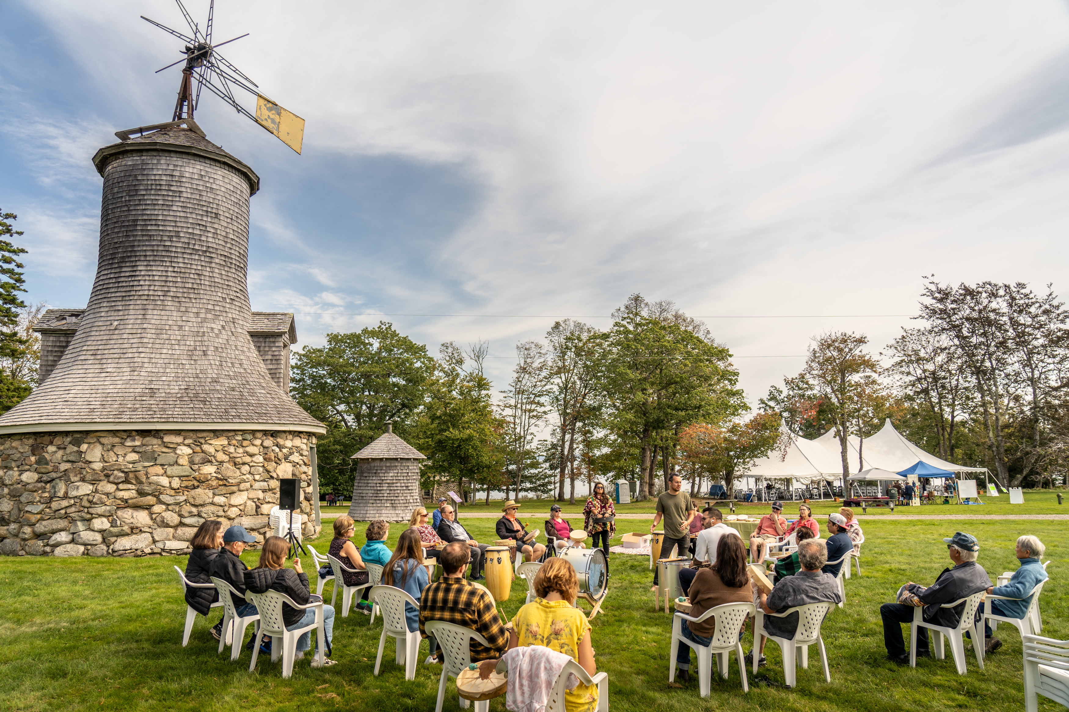 Outdoor drum circle at historic venue — Aluna
